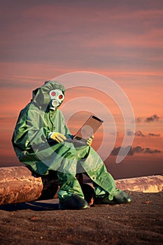 Man in protective suit works in contamination area