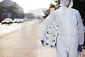 Man carrying reserves of toilet paper photo