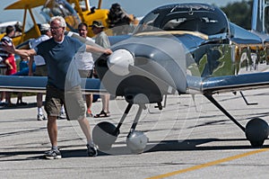 Man pulling airplane