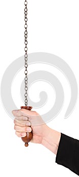 Man is pulling chain with wooden handle