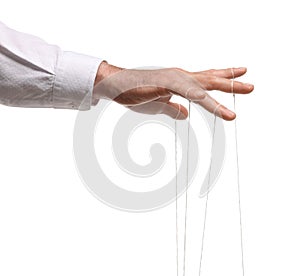 Man pulling strings of puppet on white background, closeup
