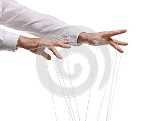 Man pulling strings of puppet on white background, closeup