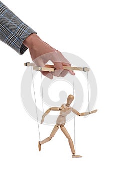 Man pulling strings of puppet on white background, closeup