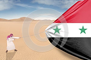 Man pulling Syrian flag