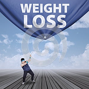 Man pulling weight loss banner 1