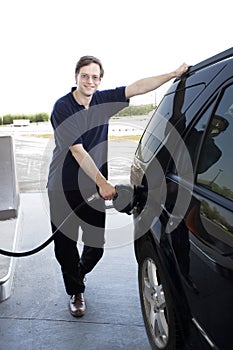 Man pumping gasoline