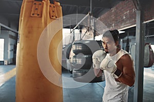 Man Punching Bag. Asian Sportsman Boxing On Intense Workout. Training At Gym For Strong, Healthy, Muscular Body.