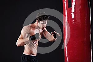 Man, punching bag or workout with fitness, exercise or fighter with progress or wellness with cardio. Boxer, practice or