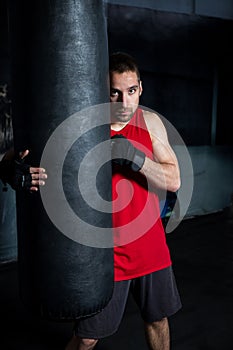 Man Punching A Boxing Bag