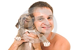 Man with a puppy pitbull