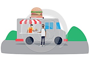 A man purchasing a burger from a food truck