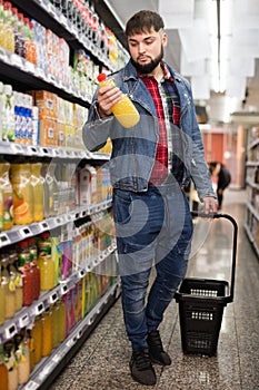 Man purchasing sweet soft drinks