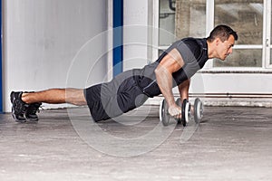 Man push up on barbell