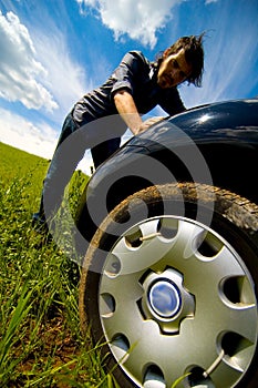 Man Pushing Car