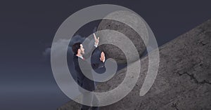 Man pushing rolling round rock