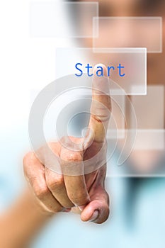 Man pushing start button