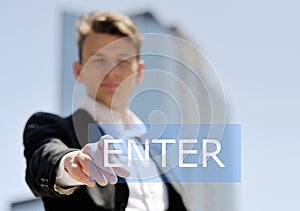 Man pushing virtual enter button - technology, internet and networking concept