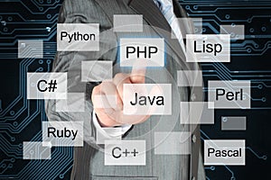 Man pushing virtual programming language button photo