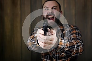 Man with put on protective goggles and ear training in pistol sh