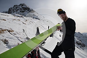 Man puts on his ski skin