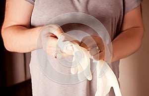 Man puts on protective rubber gloves. Protection against contagious disease and coronavirus