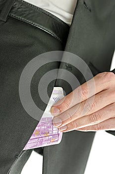 Man putting 500 Euro banknotes in his pocket