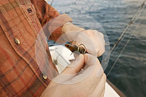 Man Putting Bait On Fishing Hook photo