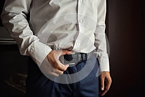 Man putting on a belt, Businessman, Politician, man`s style, mal