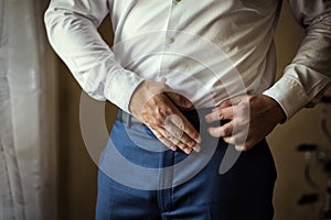 Man putting on a belt, Businessman, Politician, man`s style, mal