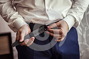 Man putting on a belt, Businessman, Politician, man`s style, mal