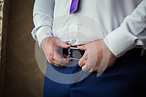 Man putting on a belt, Businessman, Politician, man`s style, mal