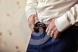 Man putting on a belt, Businessman, Politician, man`s style, mal