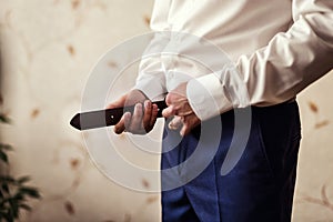 Man putting on a belt, Businessman, Politician, man`s style, mal