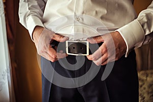 Man putting on a belt, Businessman, Politician, man`s style, mal