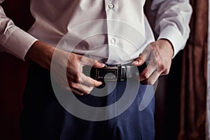 Man putting on a belt, Businessman, Politician, man`s style, mal