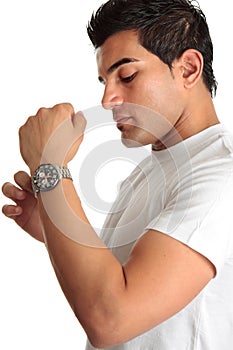 Man putting on chronograph watch