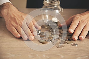 Man putting coin in piggy bank. saving money, finance concept,