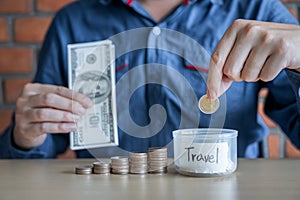 Man putting coins into money box with savings and analysis business investment strategy with income of money coin for future