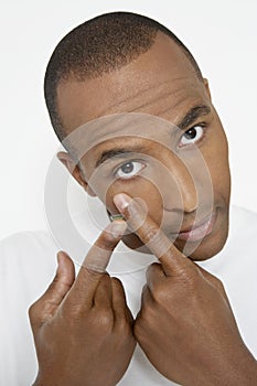 Man Putting On Contact Lens