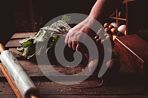 Man putting down red beets