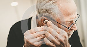 Man putting hearing aids