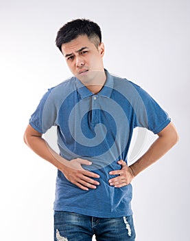 Man putting his hands for belly or stomach ache on white background