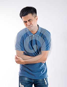 Man putting his hands for belly or stomach ache on white background