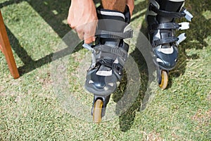 Man putting on his roller blades