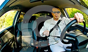 Man Putting his Seatbelt On photo