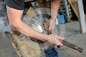 Man putting horseshoe