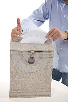 Man putting letter in mailbox,showing thumbs up gesture