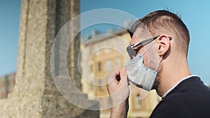 man putting the protection medical face mask on before showing up outside