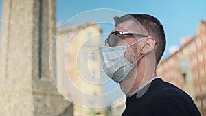 man putting the protection medical face mask on before showing up outside