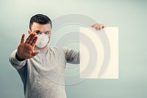 A man is putting on a protective mask. Respiratory protection from coronavirus. Personal protective equipment for a